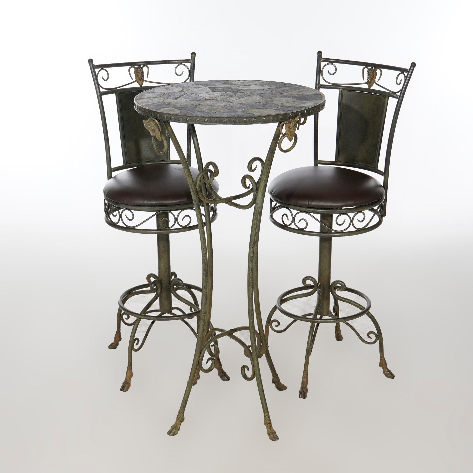 A pub set offers wrought iron frame having satyr heads, scroll elements and hoof feet; includes slate top table and two swivel chairs, 20th century

Measures- Table 43.5''H x 25''W x 25''D; Chairs 45.25''H x 16''W x 18.5''D, 28.5'' seat height