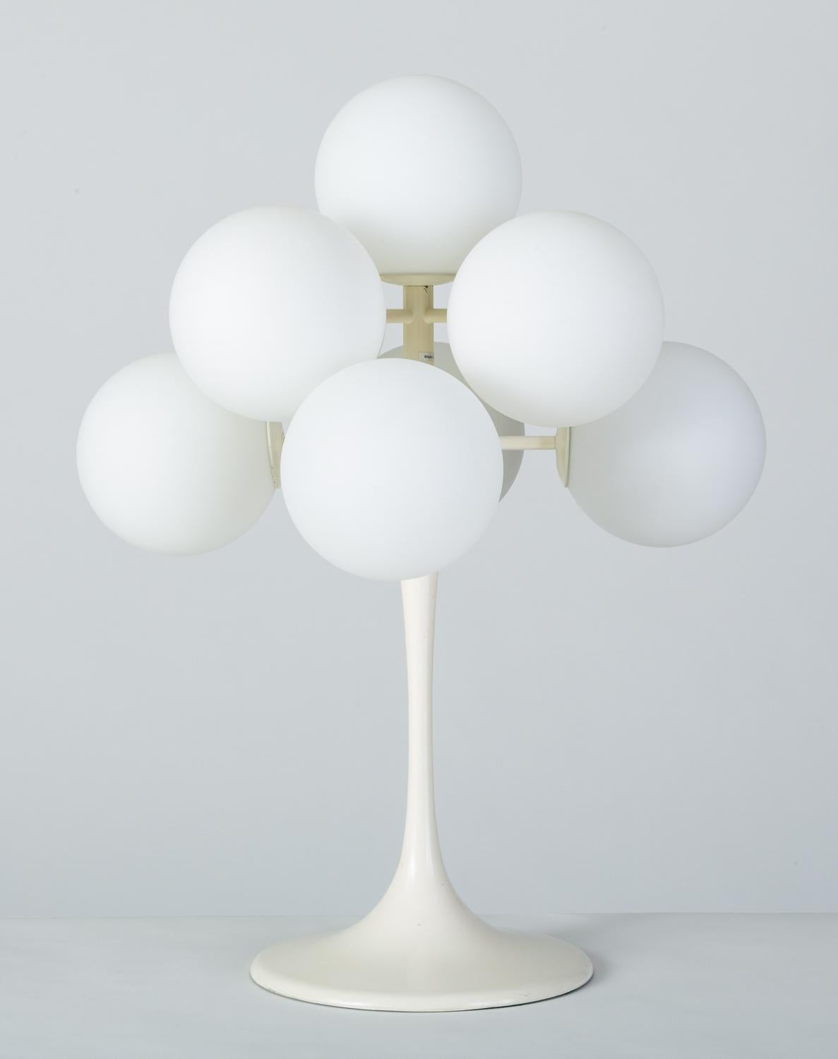 Commonly mis-attributed to Swiss architect and Industrial designer Max Bill, this series of globe lamps - known as the “Figuration” line - were actually designed by Eva Renée Nele for German-Swiss lighting manufacturer Temde Leuchten. This example,