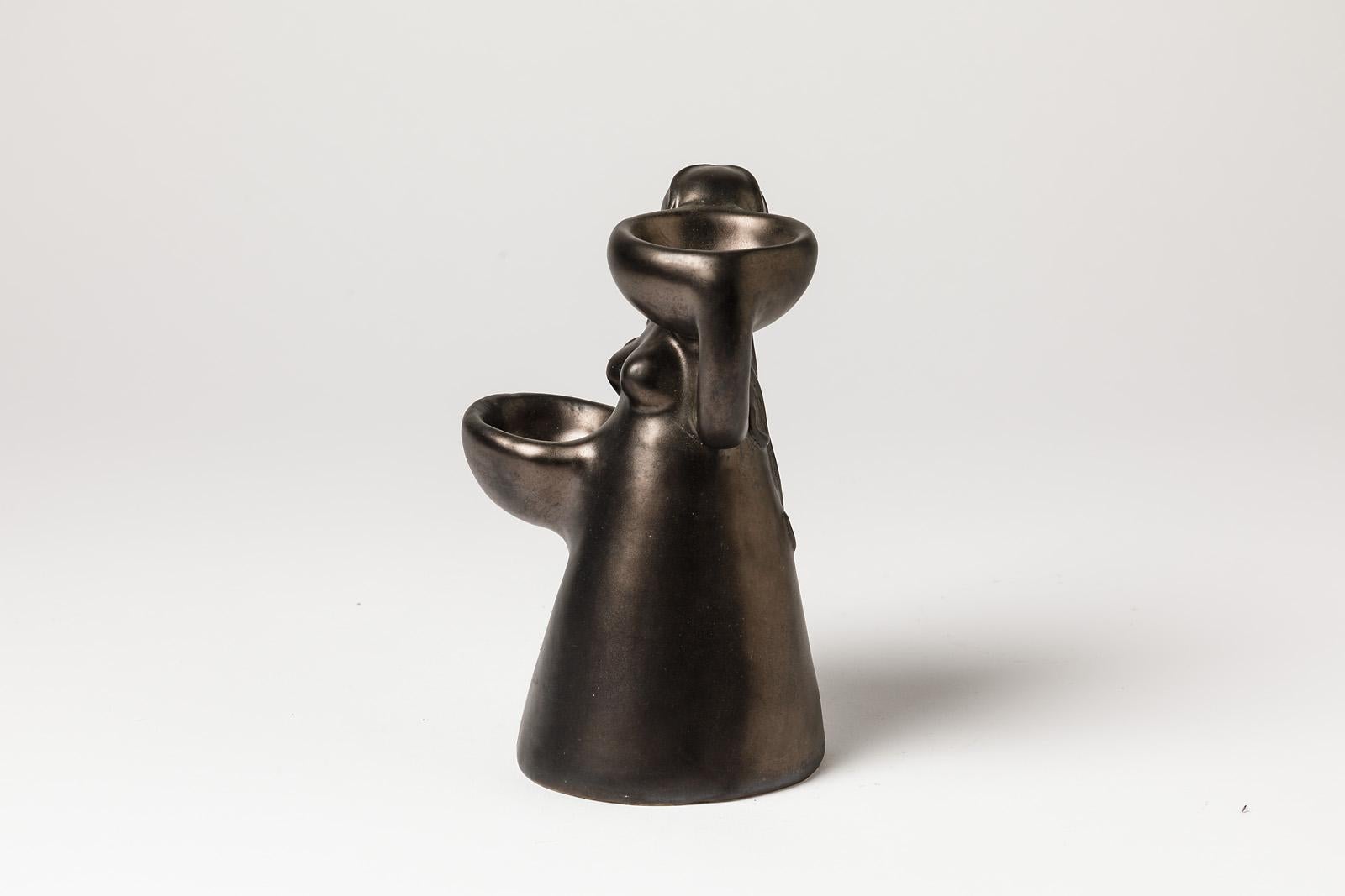 Figurative ceramic sculpture, circa 1960

Elegant black ceramic glaze color

Original mid-20th century form

Perfect condition

Measures: Height 18cm, large 12cm.