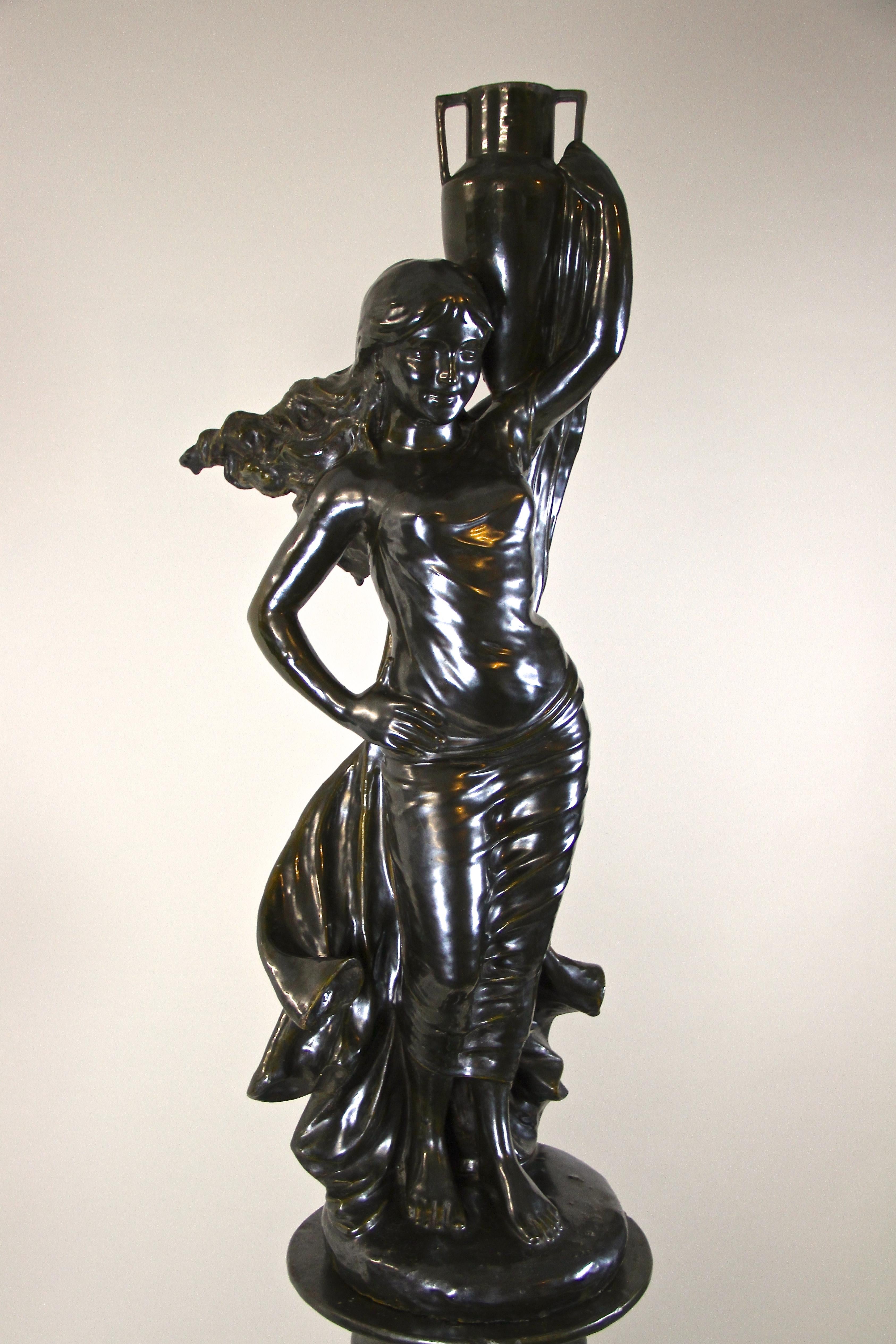 Remarkable Art Nouveau ceramic statue/ sculpture on column from the early 20th century in France. This absolute artfully shaped, very large figurative masterpiece (height of 74.4