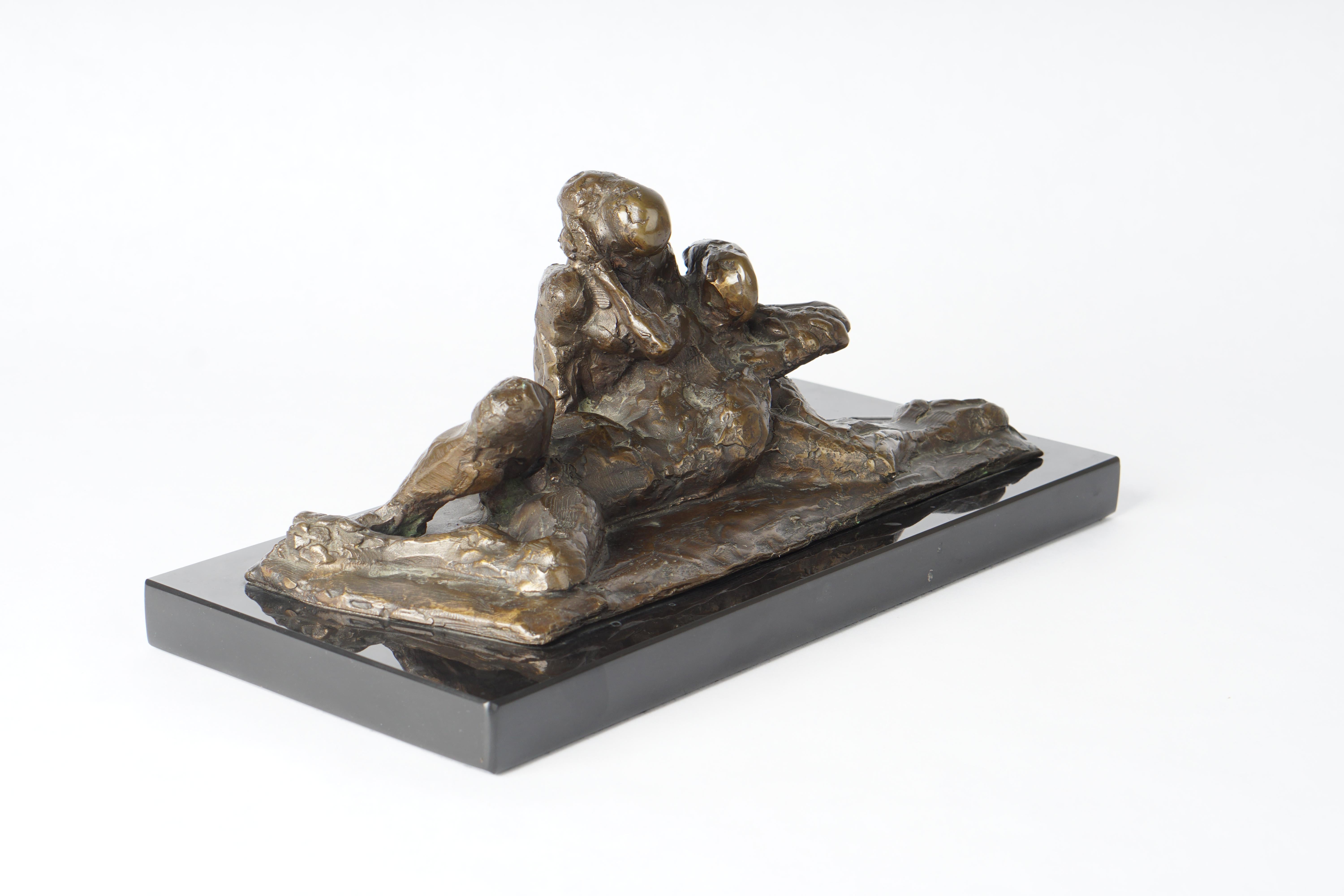 Small figurative bronze sculpture of a reclining couple, circa 1930.