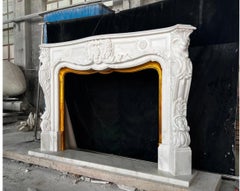 Figurative Carved Marble Fireplace Mantel