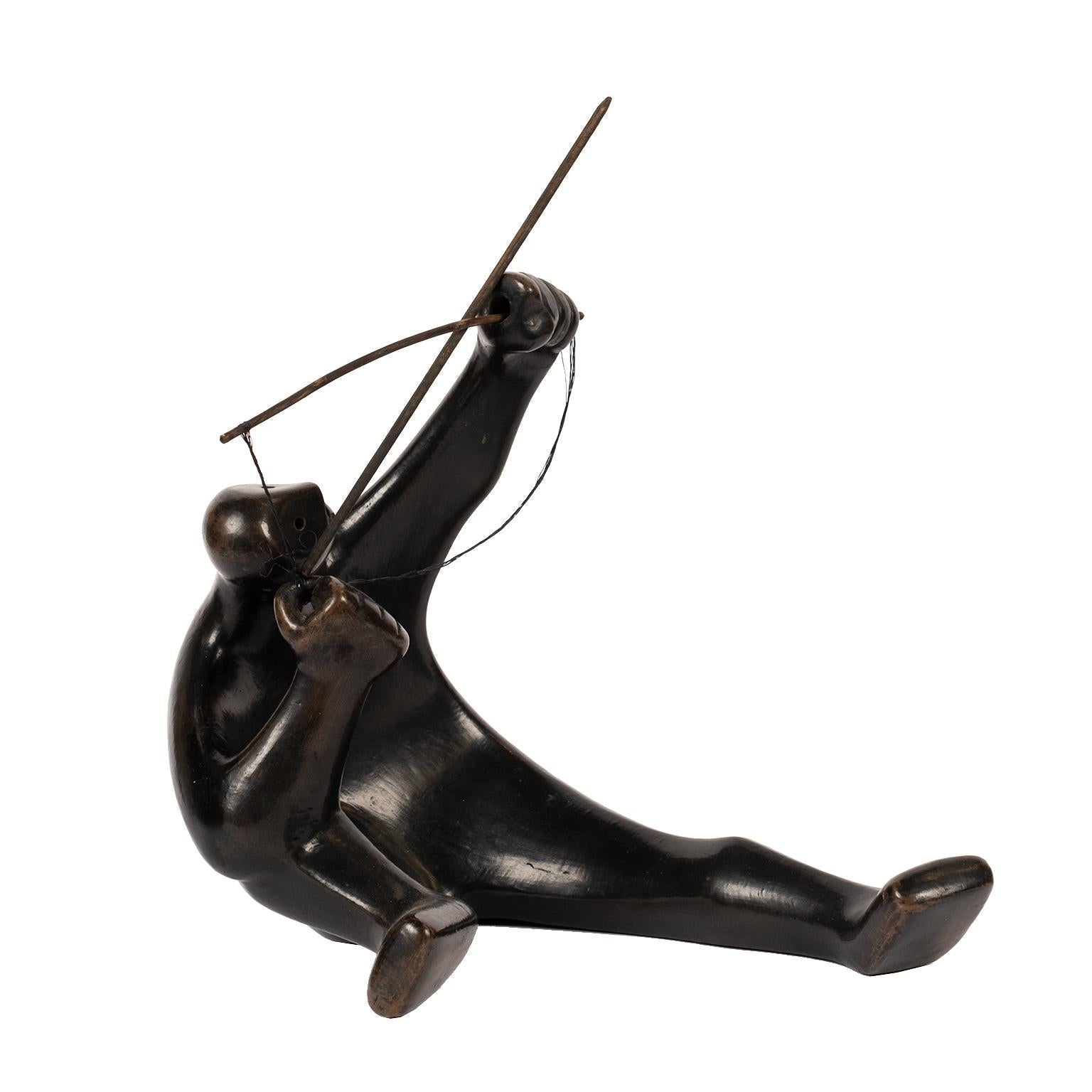 This dynamic “masked” hunter has a beautiful rich dark “bronze” patina. He is crouching and ready to launch his arrow / spear into the air.