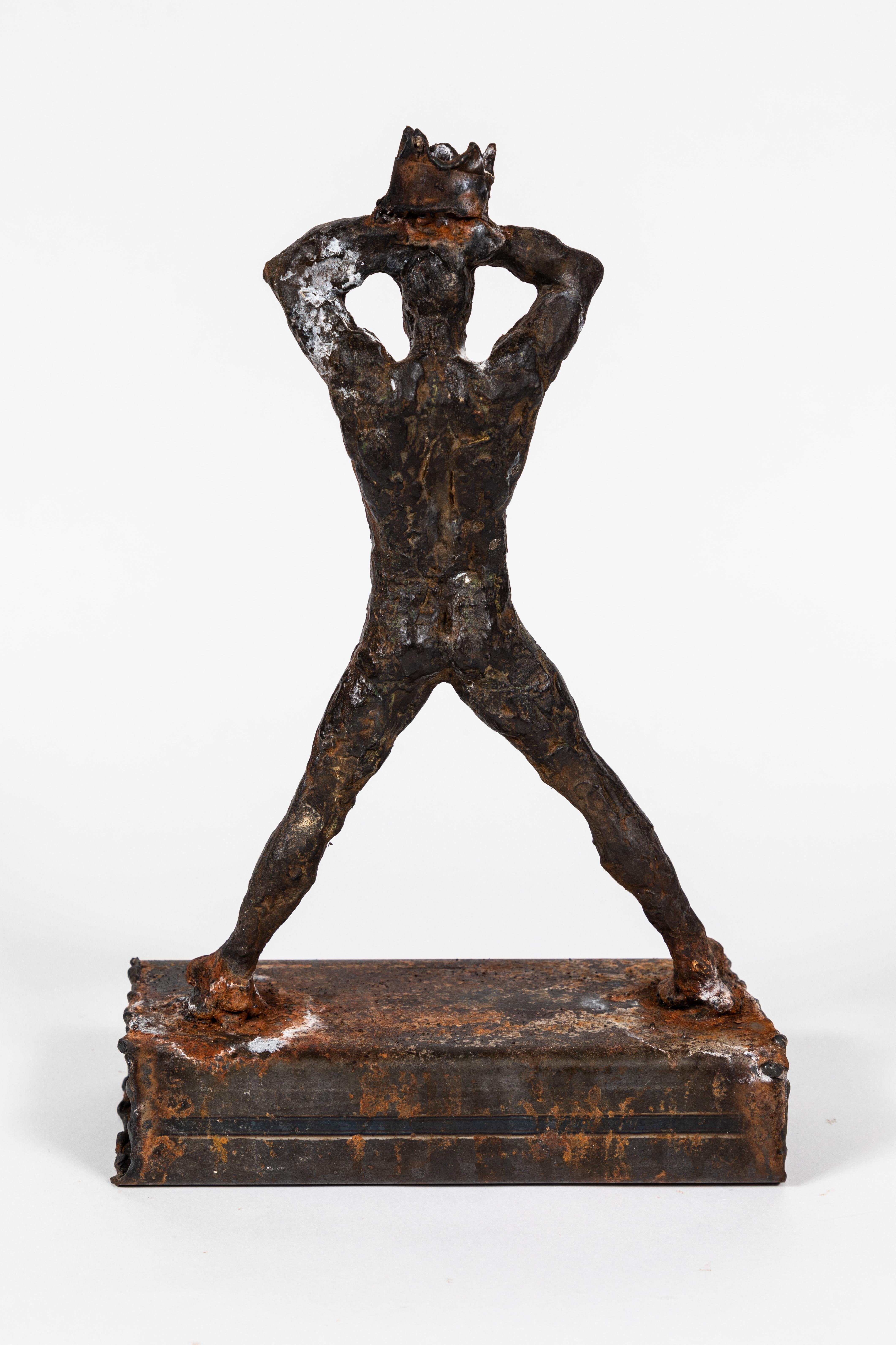 Metal sculpture of a male nude holding a crown, 1990's. Crown detail is reminiscent of a similar design used frequently in the work of Basquiat.