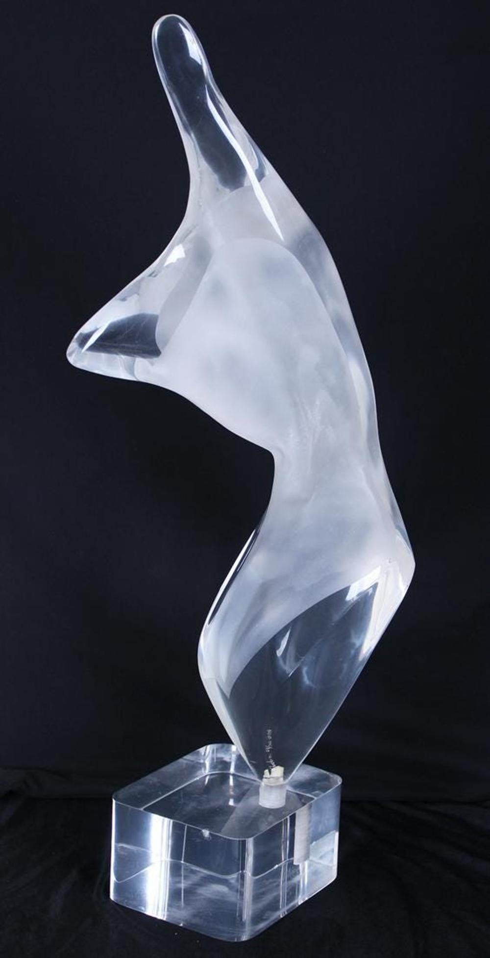 Introducing a captivating and timeless masterpiece, the Figurative Nude Sculpture in Lucite by renowned artist Michael Shacham. This exquisite artwork, signed and dated in 1984, showcases the artist's exceptional talent and attention to