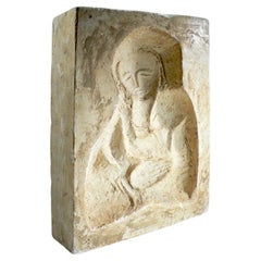 Figurative plaster sculpture from the 1950s with a French origin.