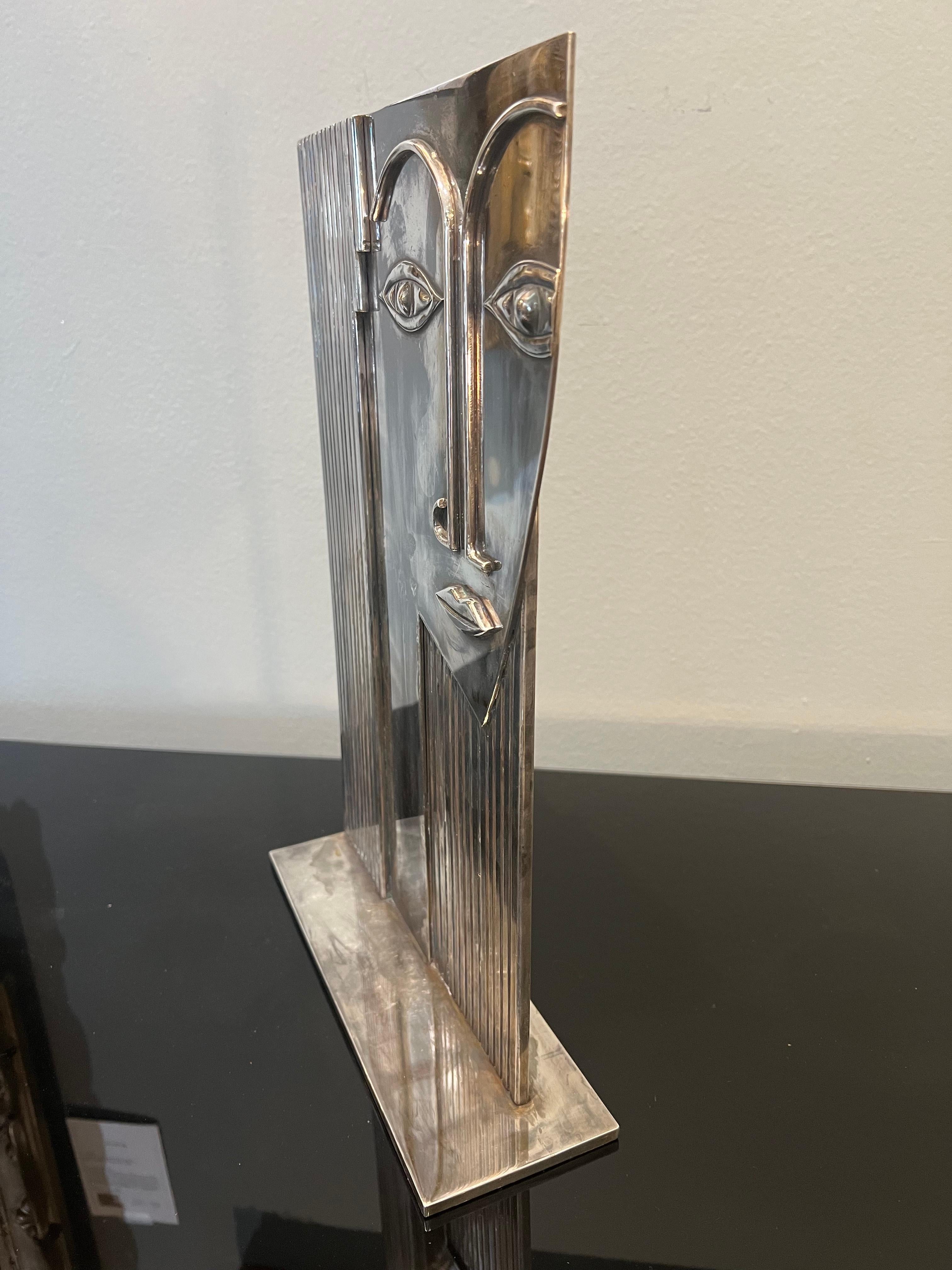 The figure of a female head, silver plated brass.
Inscribed on the bottom 