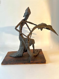 Figurative Sculpture Mounted on Wood in the Style of Giacometti