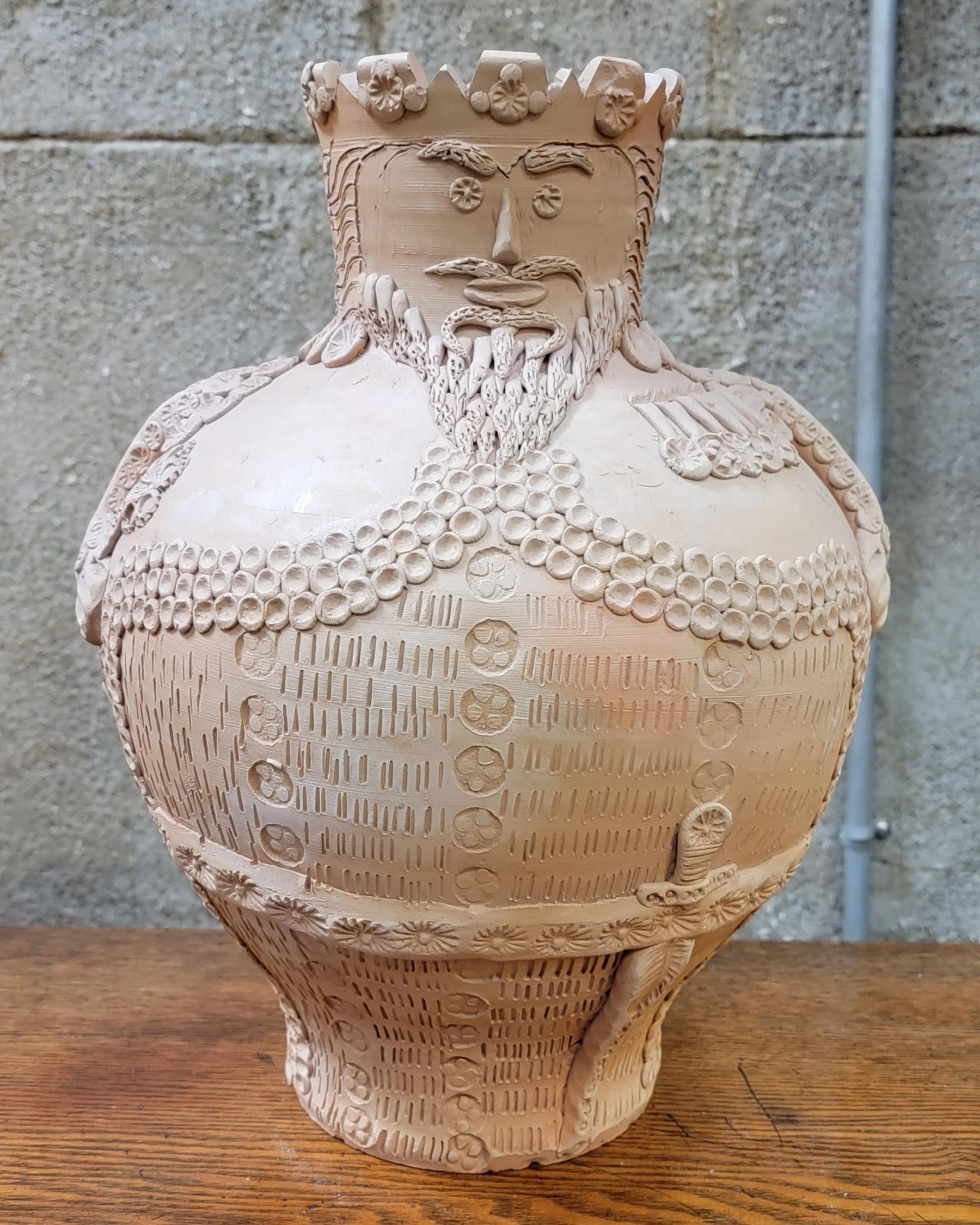 Hand thrown and hand decorated terracotta figurative vase of an officer. Stamped 