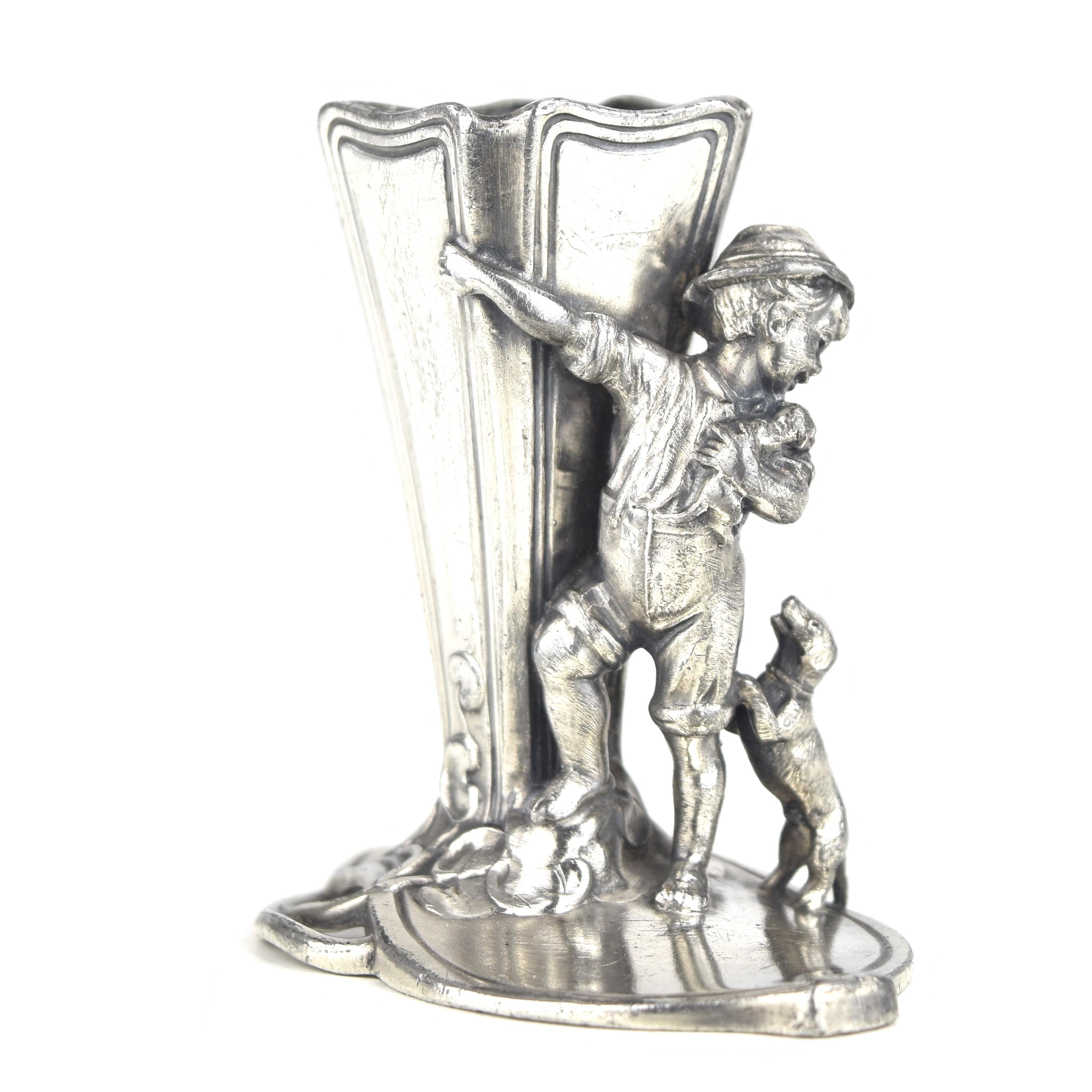 This cute antique Art Nouveau figurative toothpick holder by WMF is a delightful representation of the period's artistic sensibilities. Crafted from silver-plated pewter in a material known as 