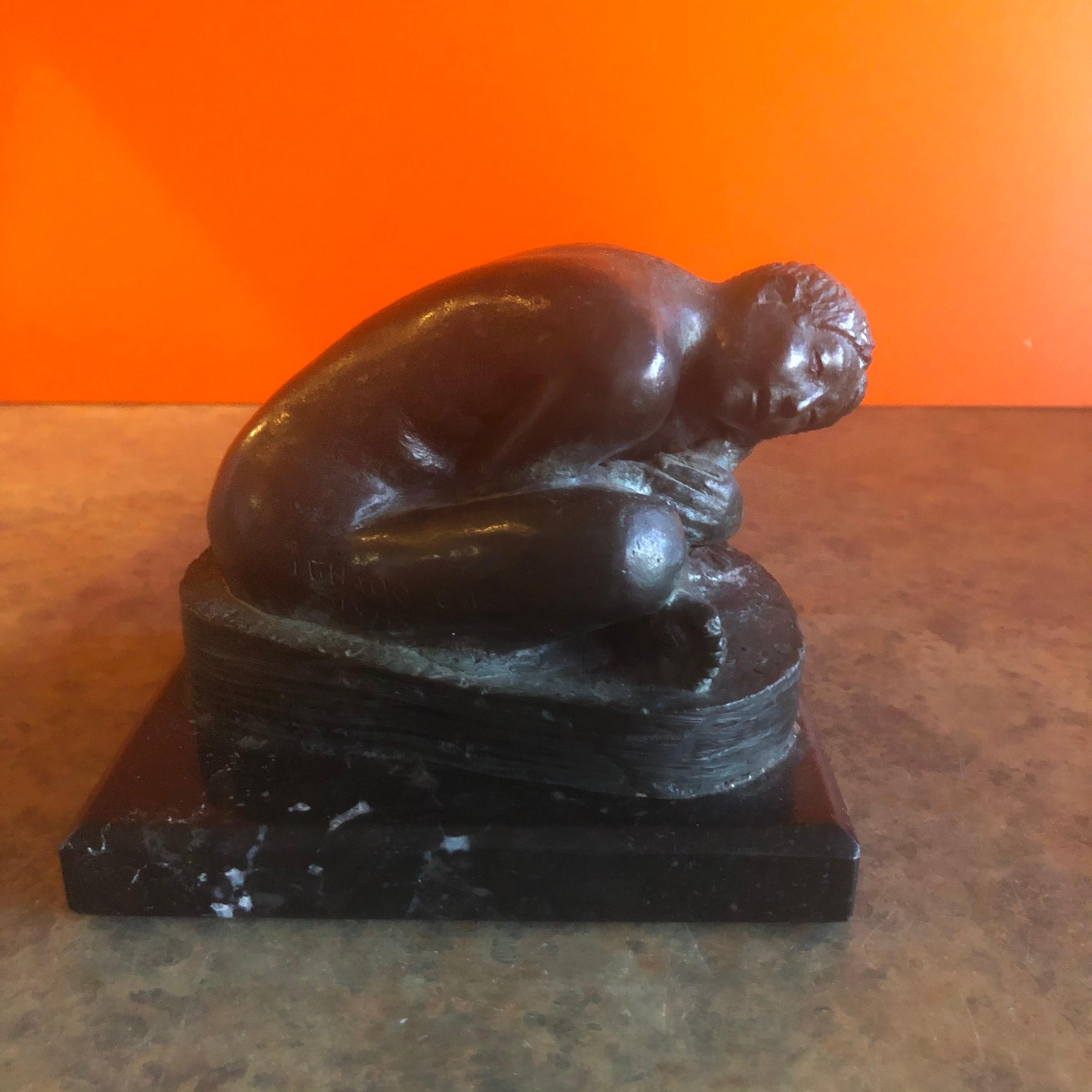 Heavy set figurative woman in bronze on black marble base by Mexican artist Ignacio Castaneda Jaramillo, circa 1980s. The piece has a wonderful patina and measures: 5.875