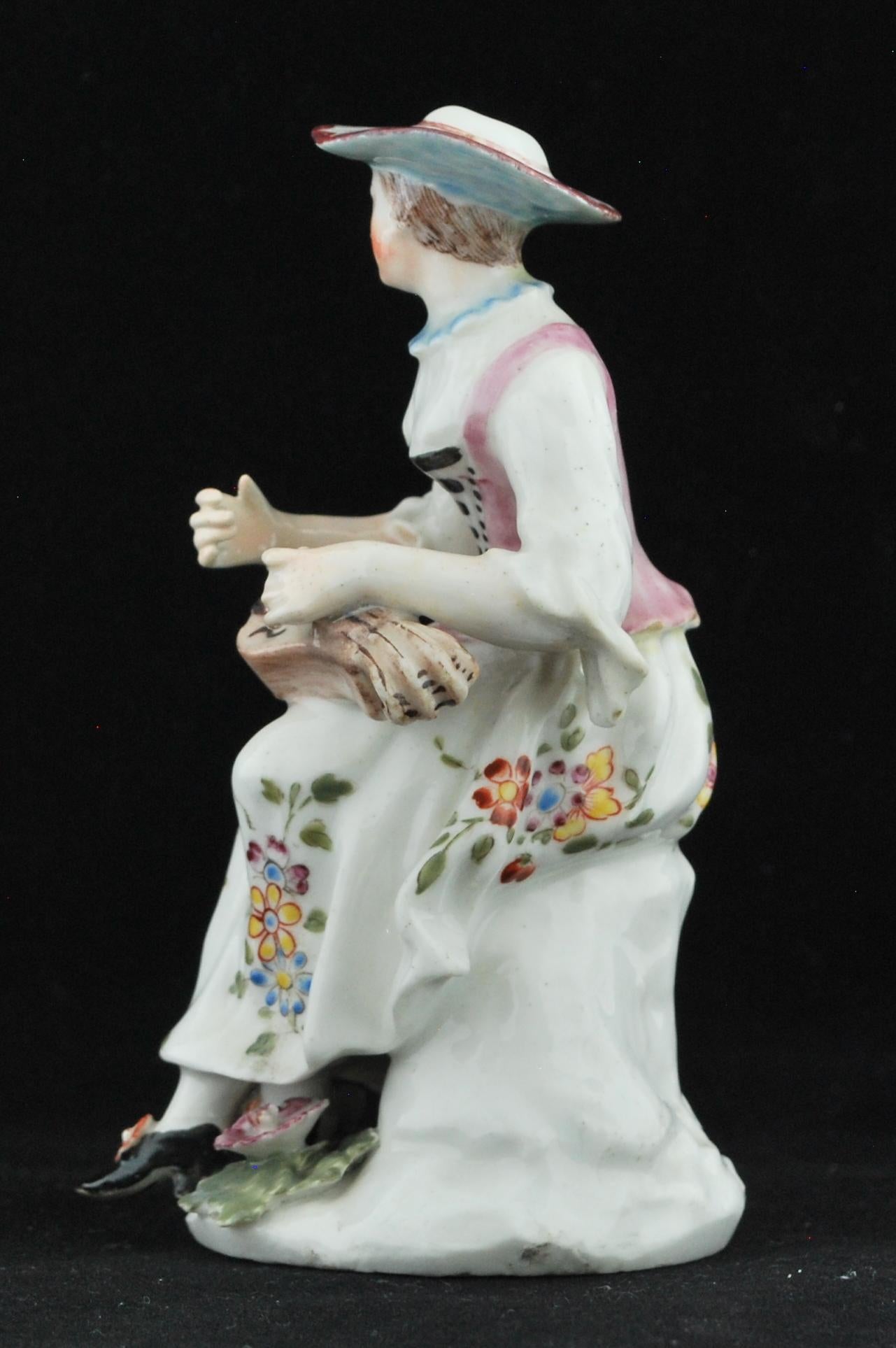 English Figure Columbine with her Hurdy Gurdy, Bow Porcelain Factory, circa 1756 For Sale