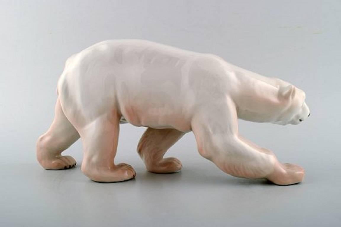 Figure of large walking polar bear (no. 425) from Royal Copenhagen.
The figure is in 1st. assortment, in perfect condition.
Measure: Height 14.5 cm, length 30 cm.
Early stamp.