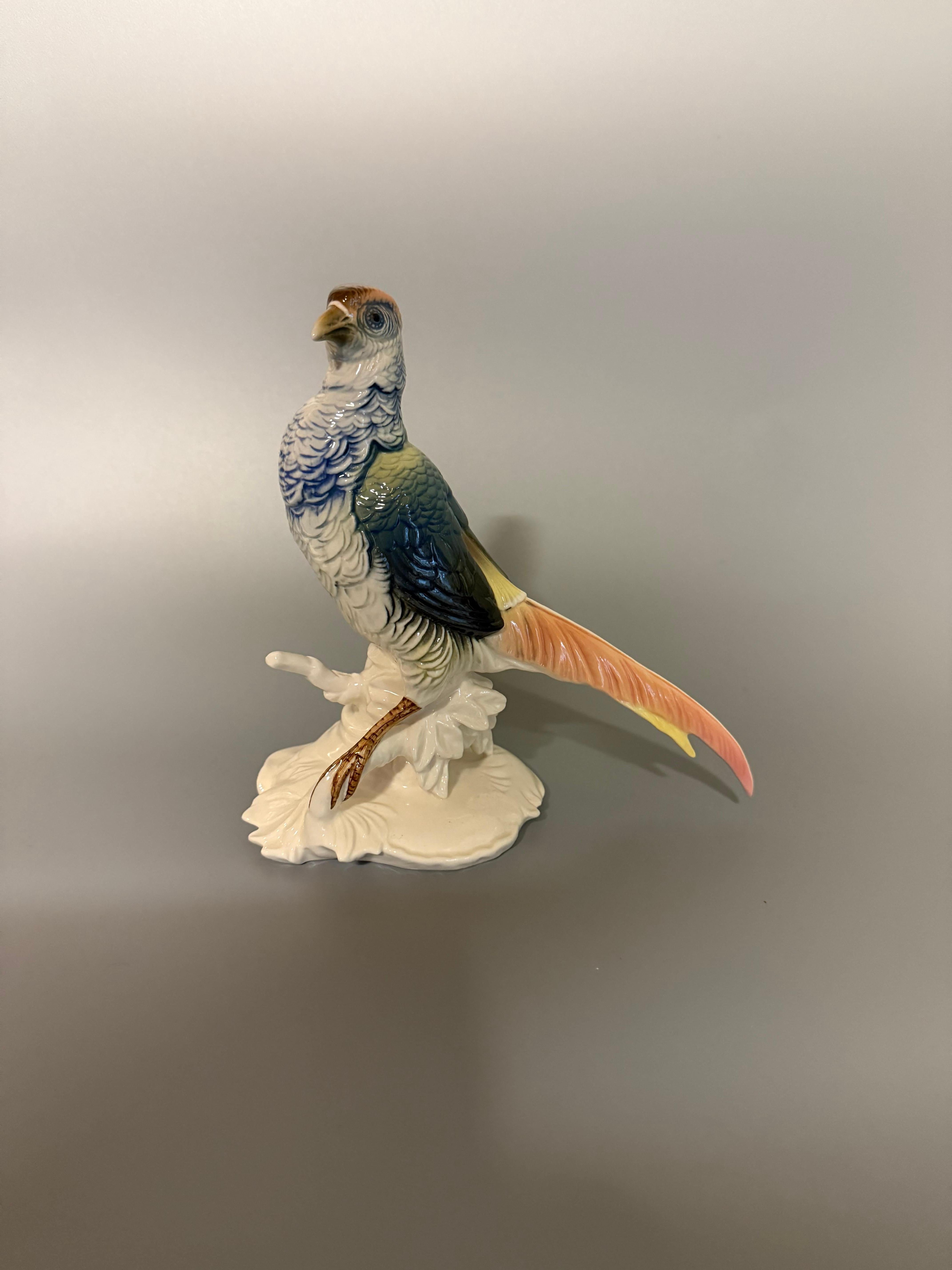 This piece is from Karl Ens, a renowned German porcelain manufacturer established in Thuringia at the end of the 18th century. 
Karl Ens figurines are known for their intricate details and vibrant colors, showcasing the artistry and craftsmanship of