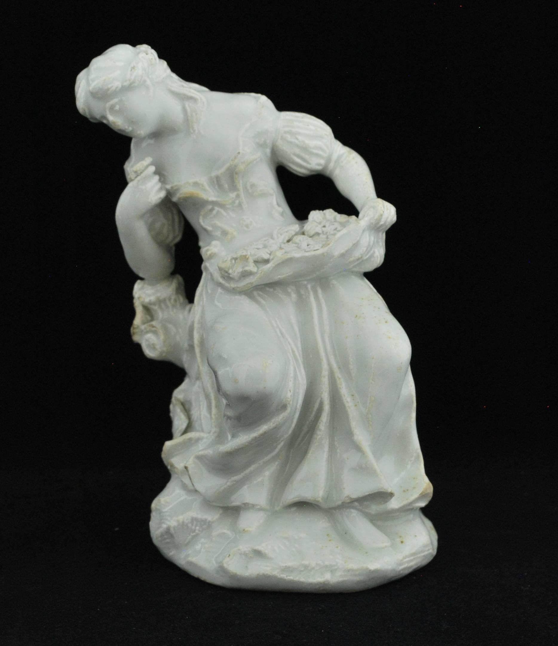 Young woman raising a flower to her nose, as smelling from a set of the senses (with hearing, sight, taste and touch). Heavily moulded, in the white, with traces of bianco outline decoration.

Prov: Taylor Coll.
    
