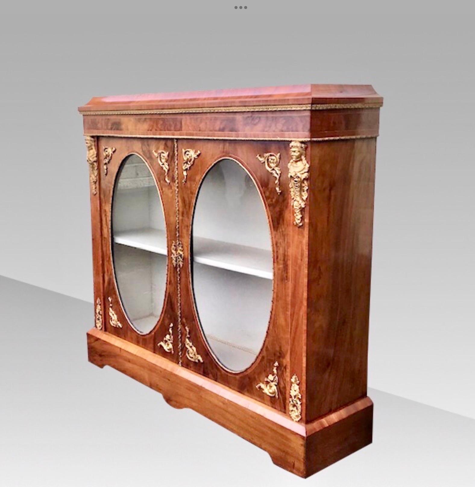 Stunning quality figured inlaid walnut ormolu mounted two doored Antique Victorian pier cabinet with oval glass panes and caddy top
Beautifully relined inside with rich cream material.
Measures: 46 ins wide x 43.25 ins x 12.25 ins deep.
Circa