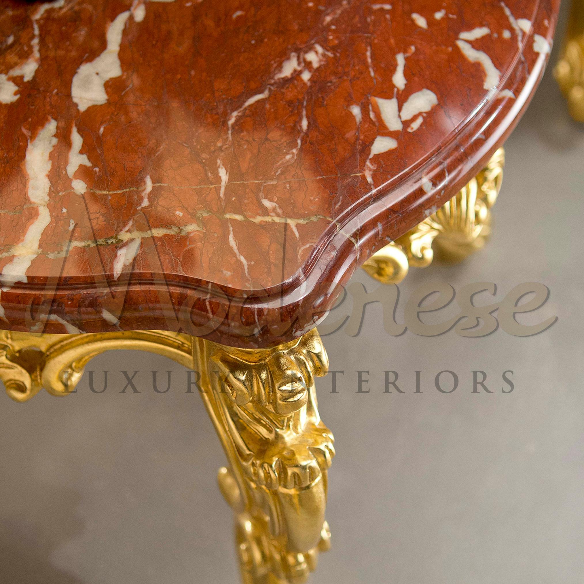 Neo Baroque figured side table with french red marble top and gold leaf finished sqare structure. This piece represents exquisitively well Modenese's skills in blending wood and marble. Our product stands a real italian luxury décor for residential