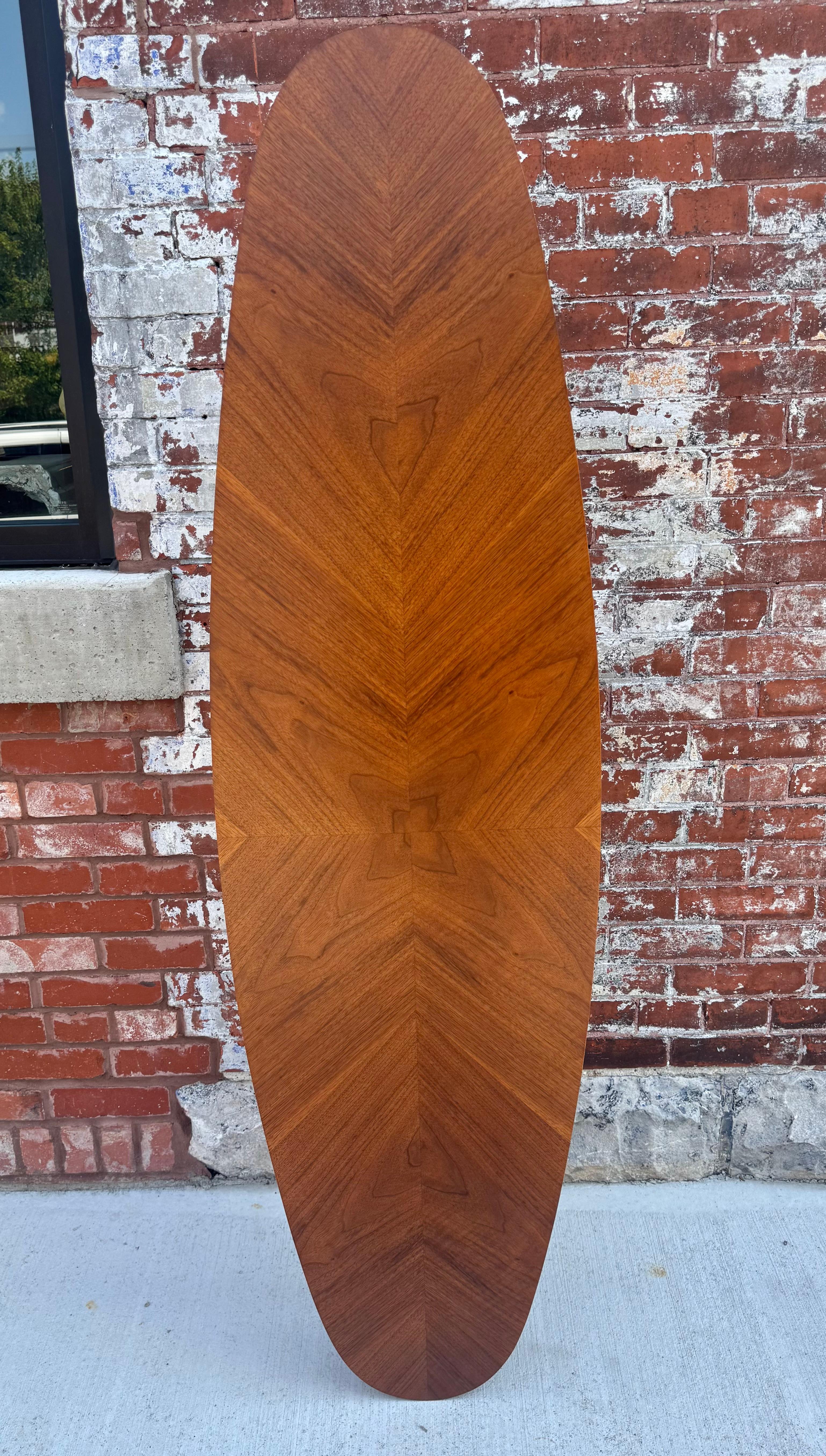 Figured Walnut / teak  and Stainless Steel Surfboard Table by Arne Vodder.. Amazing design.. Great size.proportion,  Wonderful book-matched veneers,, Hand delivery avail to New York City or anywhere en route from Buffalo NY