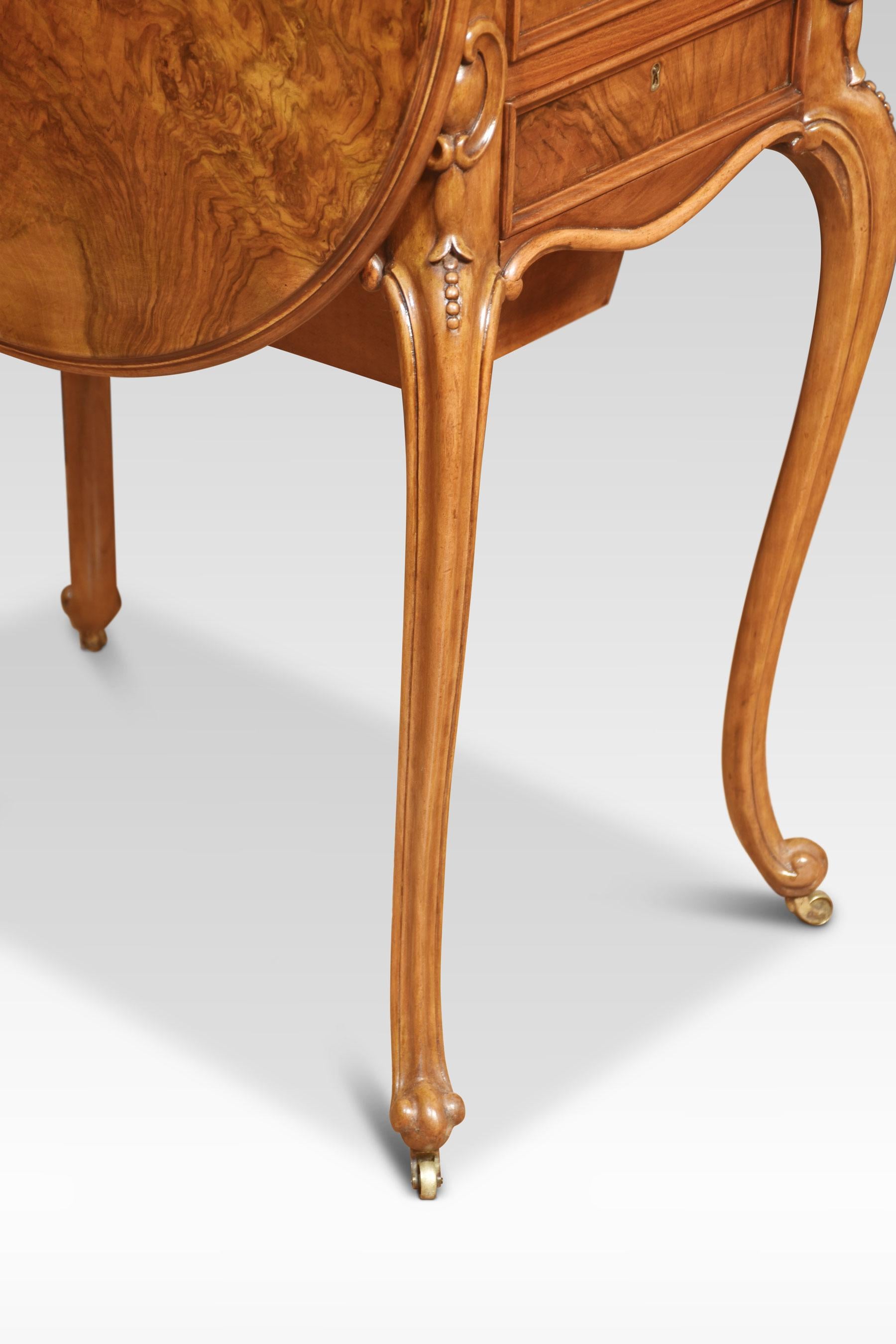 Walnut side table the well figured top having lift up ends and moulded edge. two the freeze fitted with drawers and sewing box below. All raised up on four slender cabriole supports terminating in castors.
Dimensions
Height 27.5 Inches
Width 16