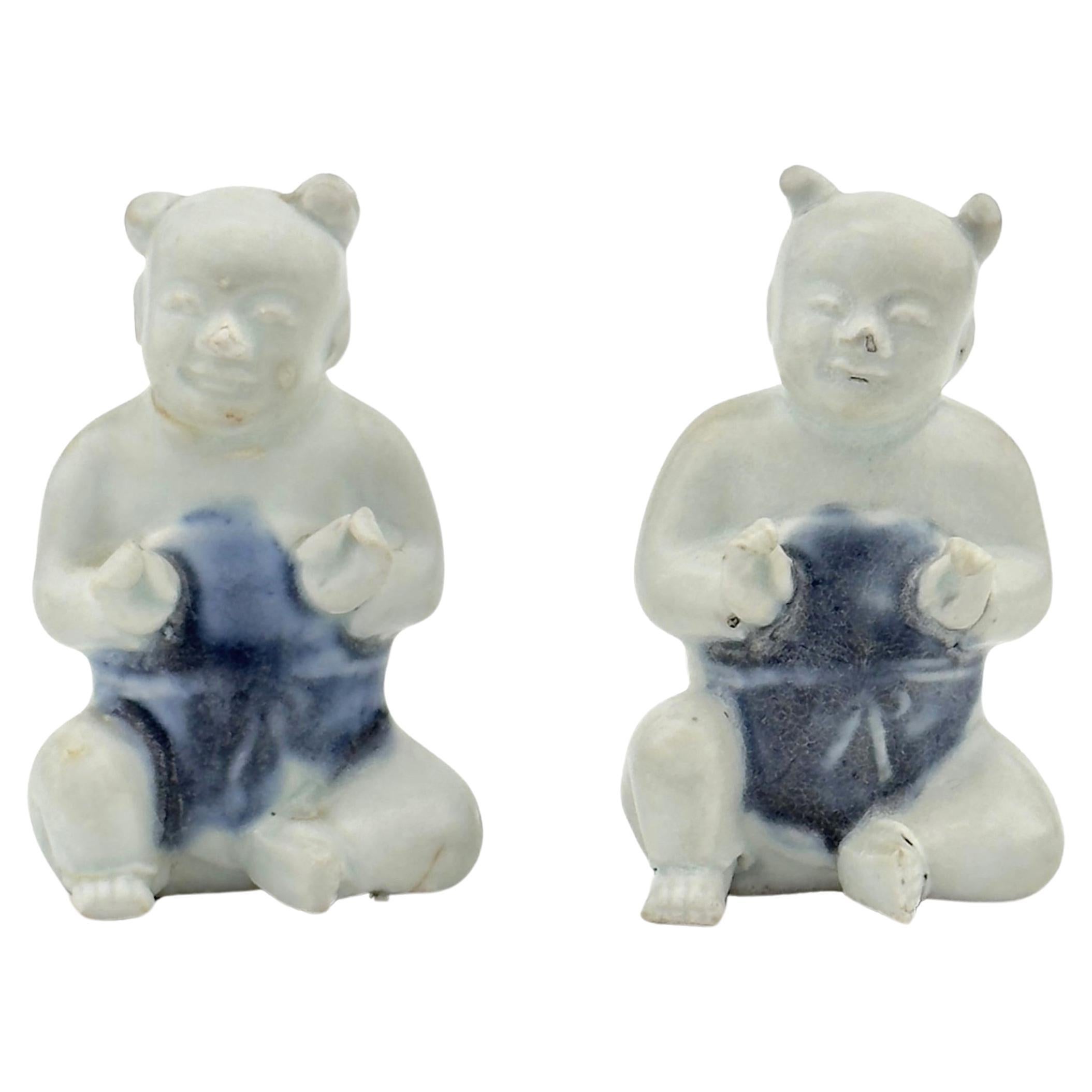 Two Figurine of Seated Boys, Circa 1725, Qing Dynasty, Yongzheng Reign For Sale