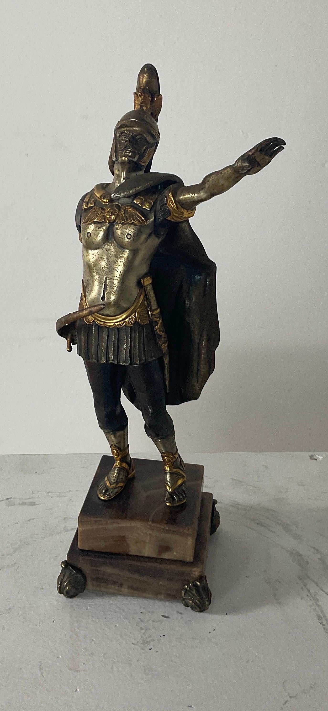 The figure of a Roman general in the military form of the Imperial Guard of the eighteenth century, made by the recognised Italian master Giuseppe Vasari (1934 - 2005) presumably in the seventies. Marked on the back. Bronze with gold and silver