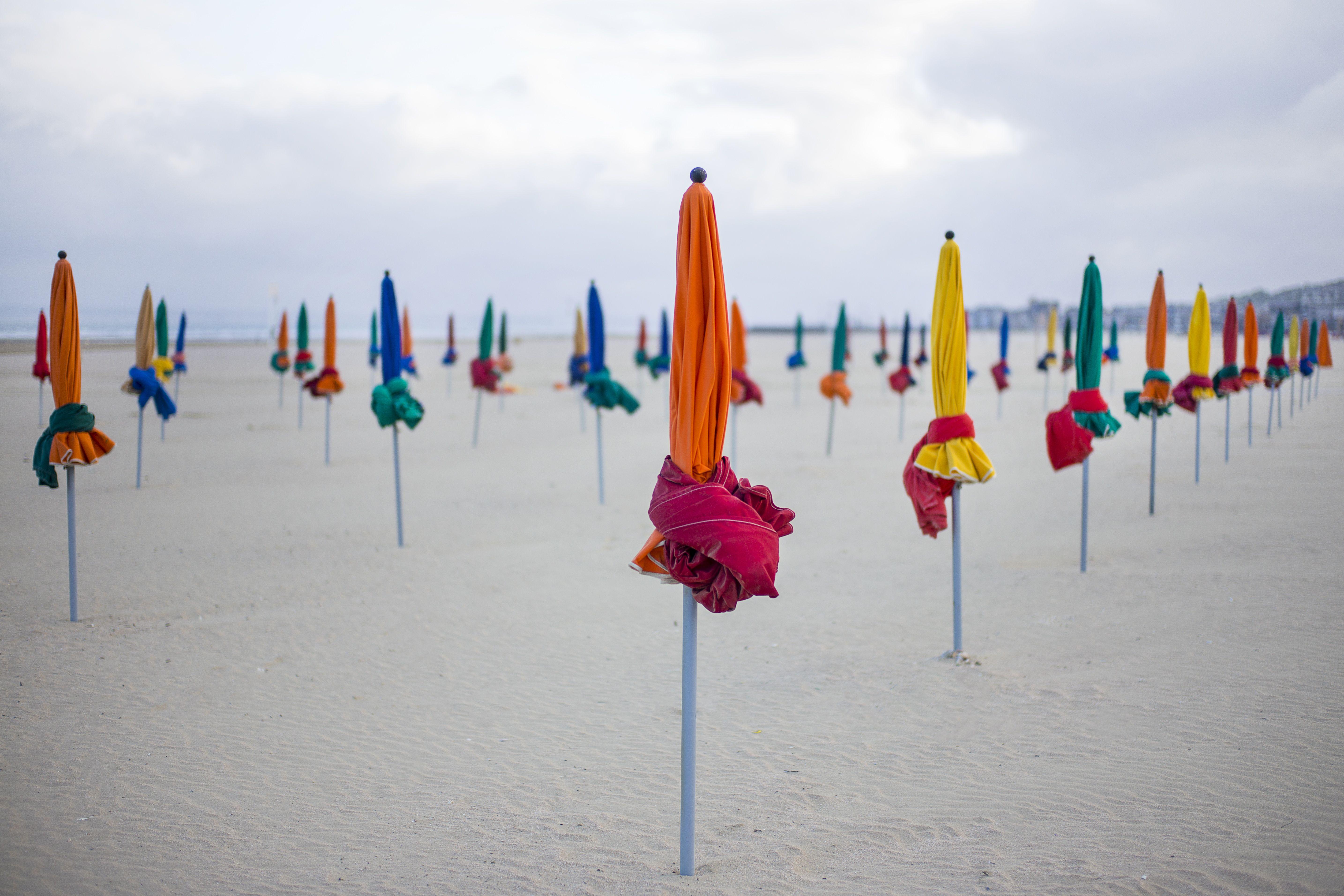 The umbrellas of Deauville, Digital on Paper - Print by Fikry Botros