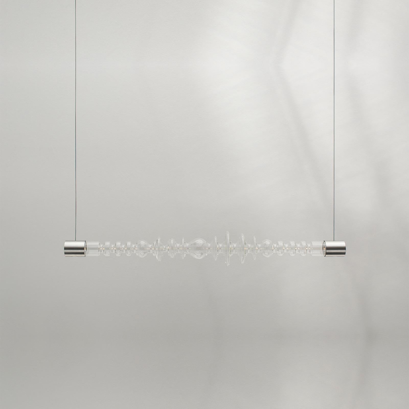 The Filamento light was designed as a modular system. Each of the 1.26-metre-long lights can be attached to one another. The studio attached four Filamento pieces together to form a five-metre-long installation for Rossana Orlandi's space. The light