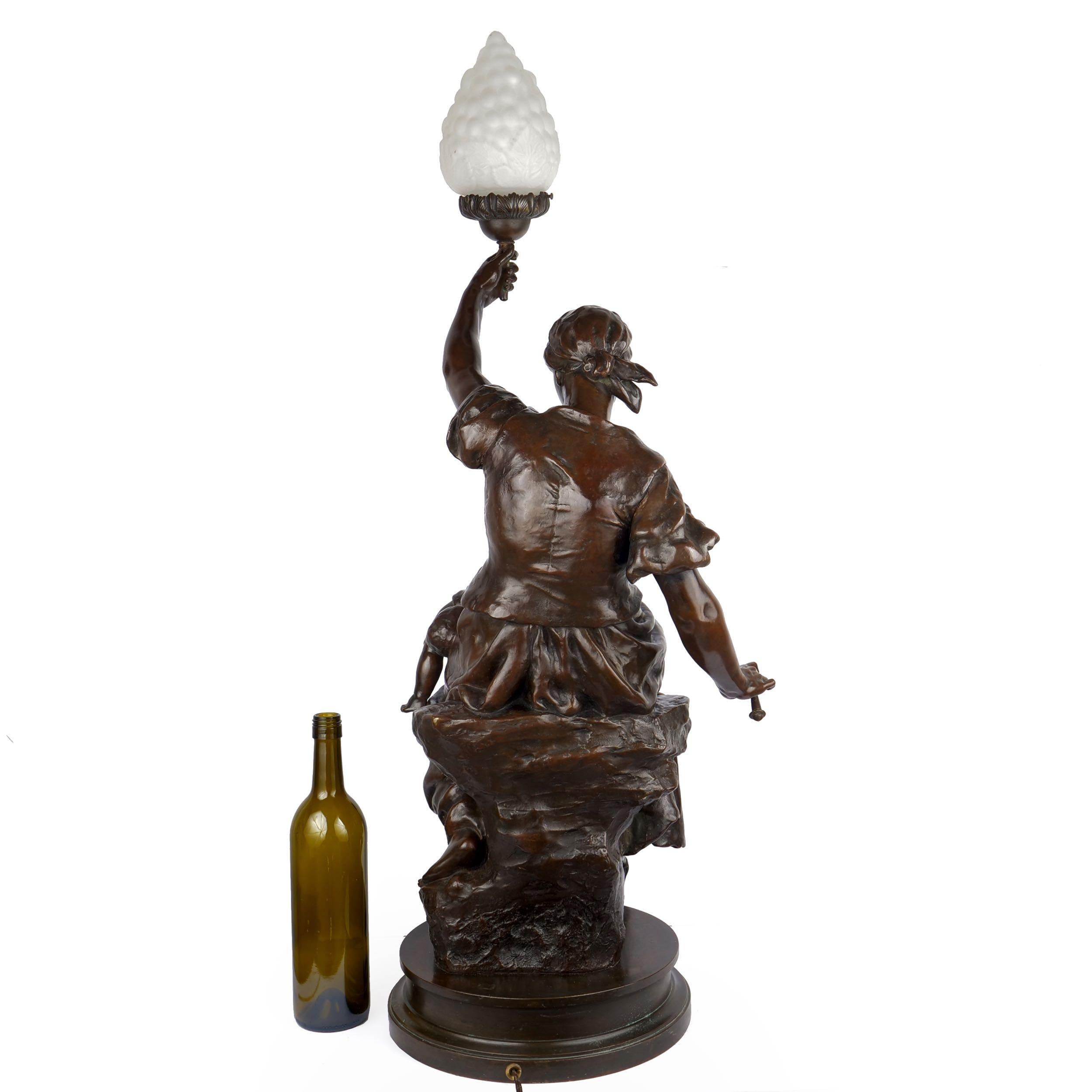 Romantic “Fileuse et Enfant” Torchiere Lamp Antique Bronze Sculpture by Emile Peynot