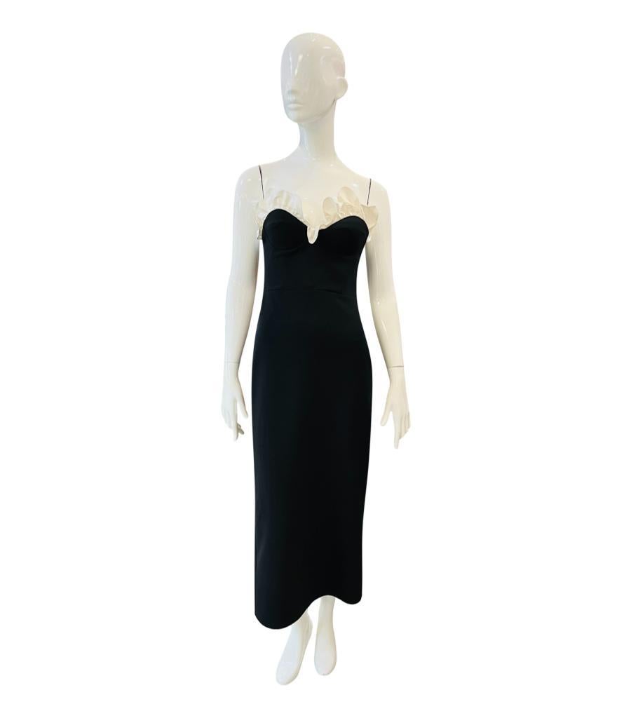 Filiarmi Strapless Dress With Silk Ruffle Neckline
Black 'Diana' dress designed with sweetheart neckline embellished with white ruffle.
Featuring fitted silhouette, mid-calf length and zip closure to the side. Rrp £592
Size – 6UK
Condition – Very
