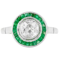 Filig Verlobungsring, runder Diamant mit Smaragd auf Platin