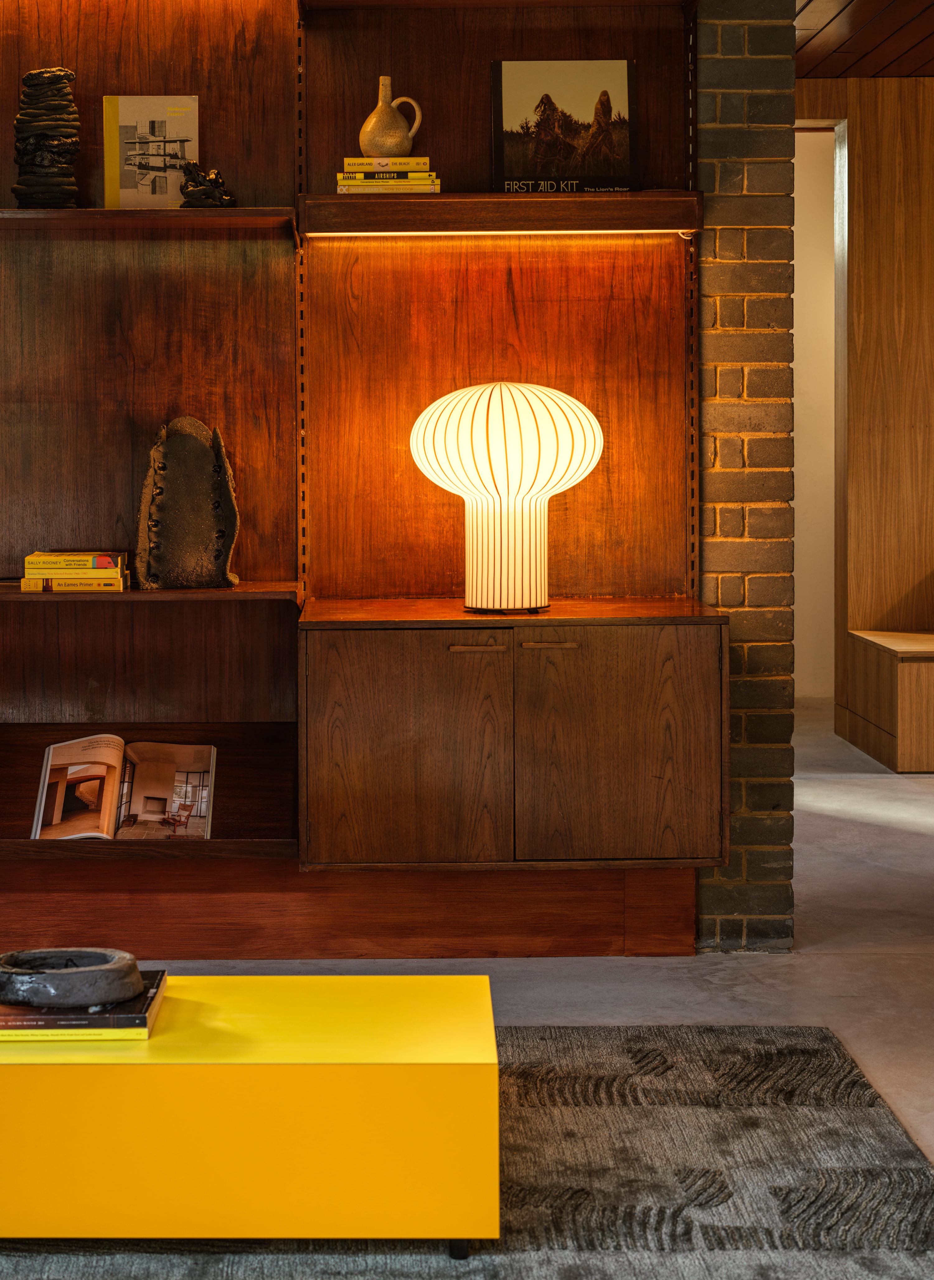 An impressive sculptural addition to the iconic Filigrana range bySebastian Wrong. A large, mushroom table light with a soft diffusedglow, this beautifully designed lamp is an eye-catching statementpiece. Featuring candy-coloured cane stripes around