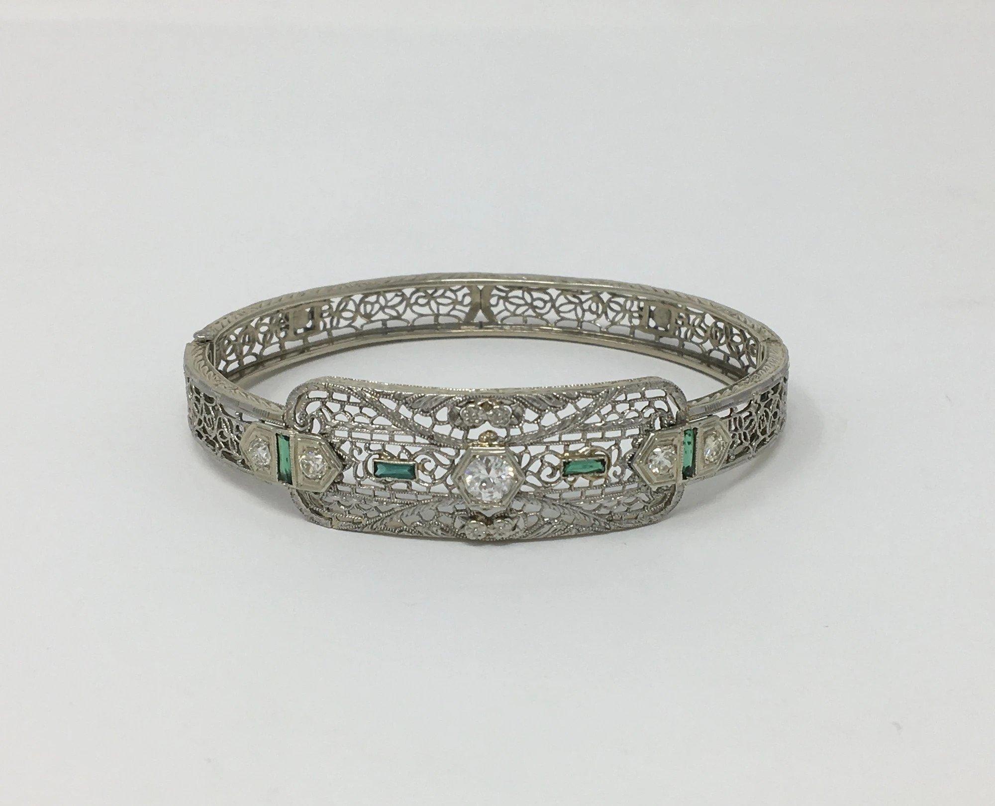 Fine 14-karat white gold, diamond, and emerald glass Art Deco bracelet.