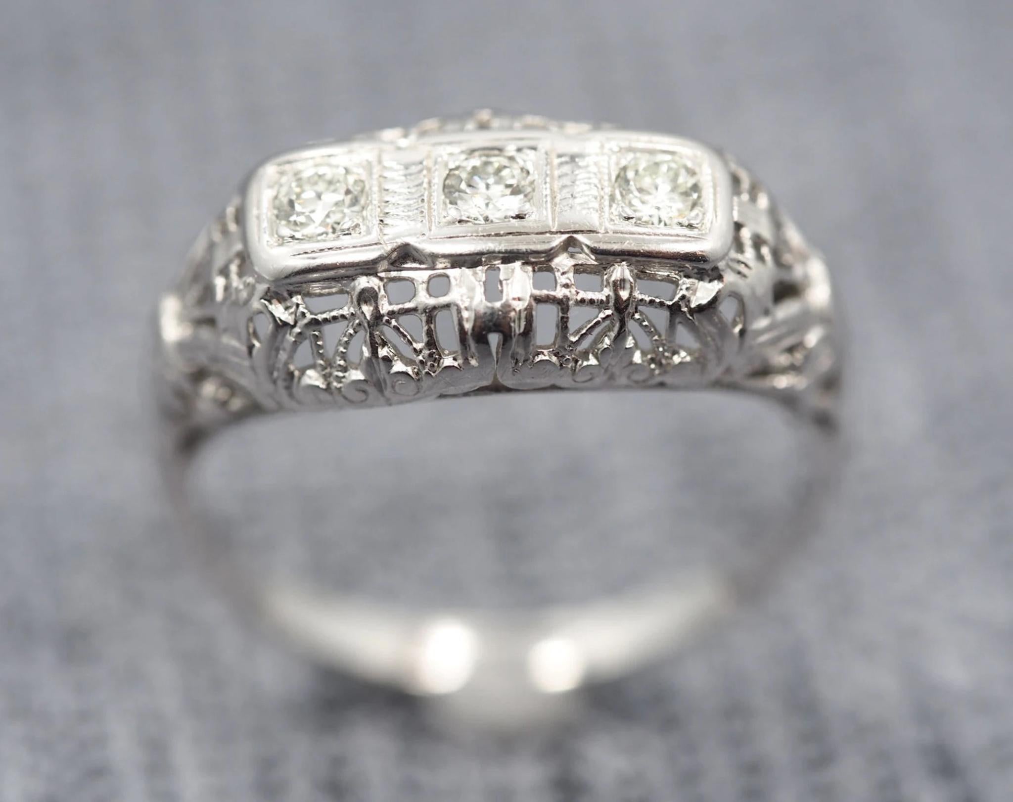 Item Details:
Ring Size: 6
Metal Type: 14K White Gold
Weight: 2.70 grams

Diamond Details
Shape: Old European Transitional Brilliant
Carat Weight: .15ct
Color: G
Clarity: SI1

Finger to Top of Stone Measurement: 4.41mm