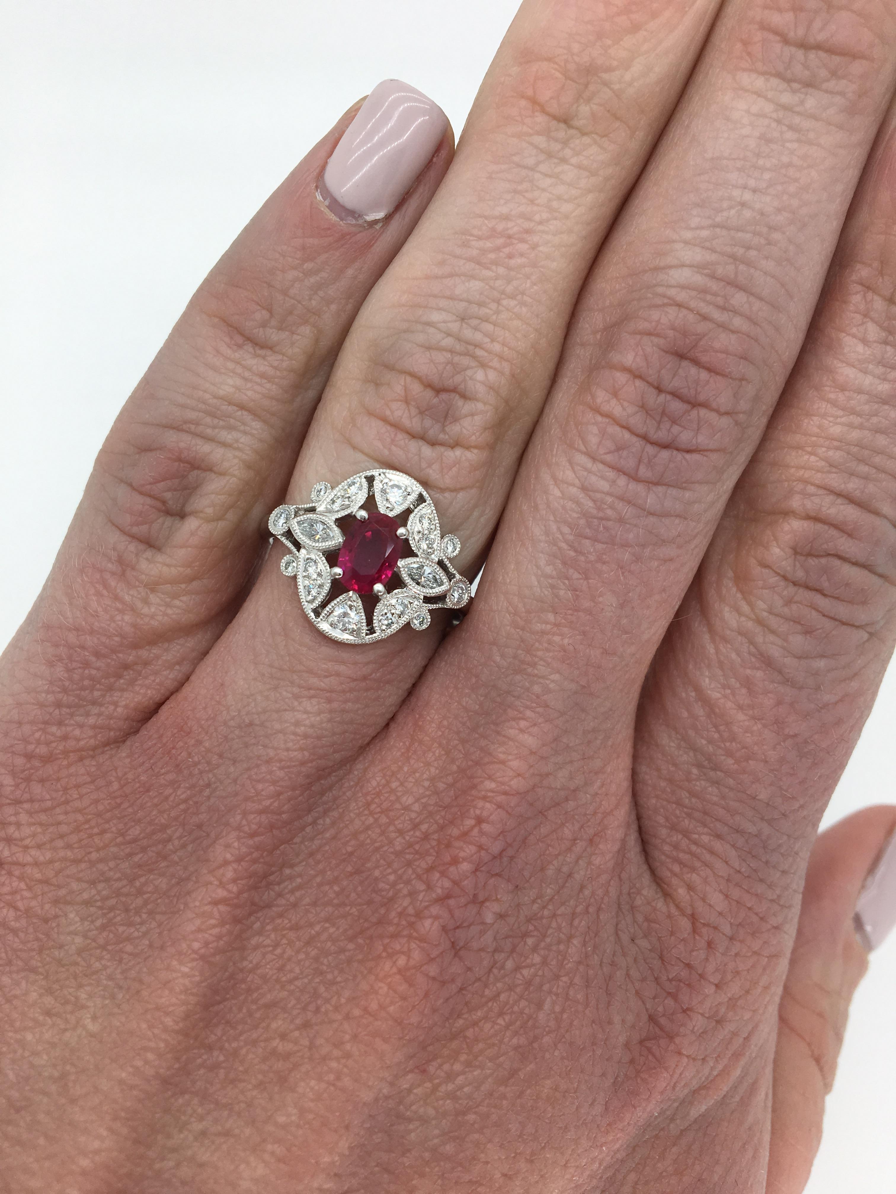 Approximately .68CT Oval Cut Ruby mounted in a vintage inspired platinum setting with diamond and filigree detail.

Gemstone: Diamond and Ruby
Gemstone Carat Weight: Approximately .68CT Oval Cut Ruby
Diamond Carat Weight: Approximately