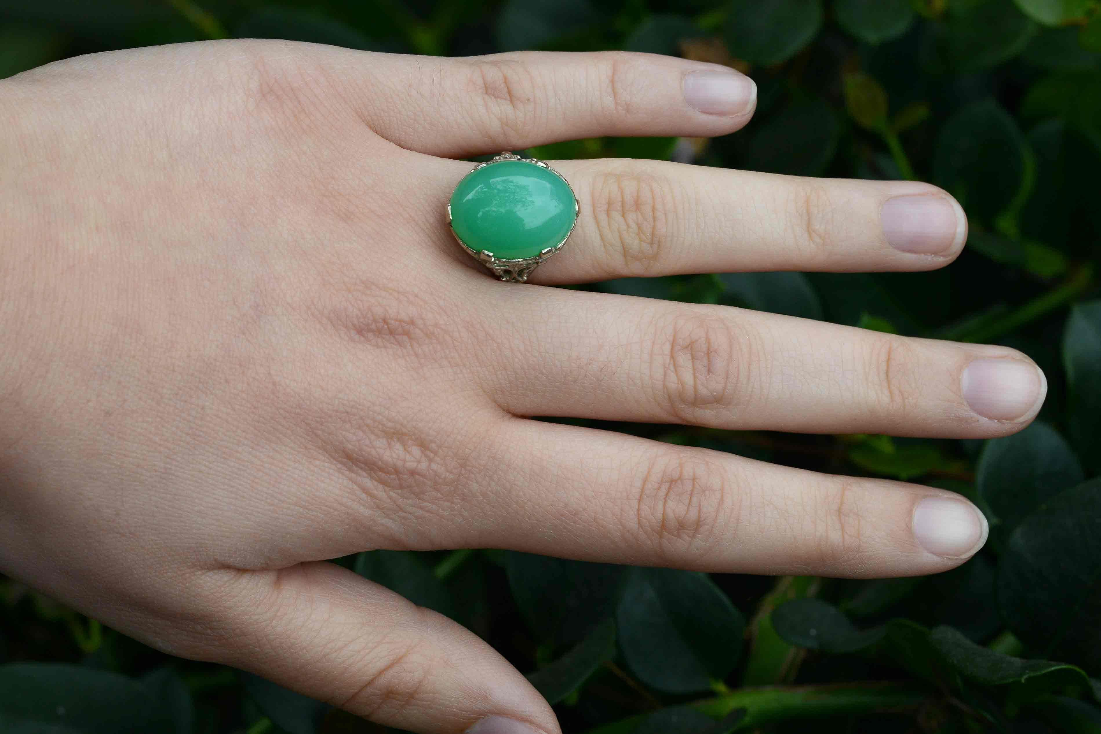 The Lubbock Victorian filigree cocktail ring. A most enchanting and soothing gemstone of a captivating and lustrous apple-green, this dome cabochon takes center stage in this Victorian inspired stunner. You will swoon over her fabulous foliate