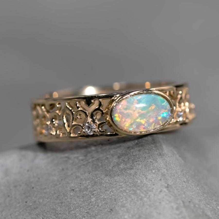 Exquisite Filigree Engagement Ring: Australian Semi-Black Opal Diamond Band in 18K Yellow Gold.

Free Domestic USPS First Class Shipping! Free Gift Bag or Box with every order!

Opal—the queen of gemstones, is one of the most beautiful gemstones in
