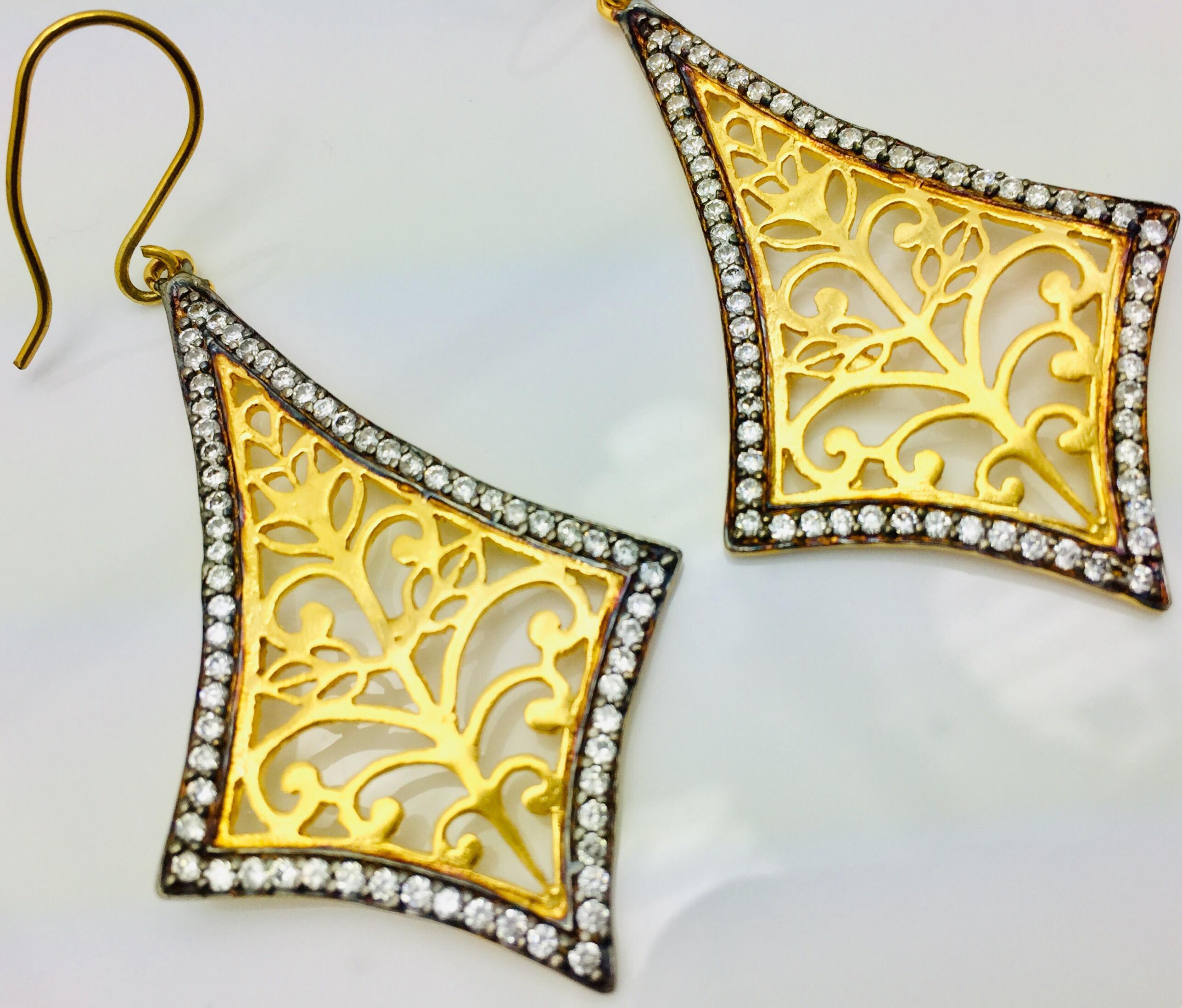The handmade filigree earrings is ornate and lovely, it is enhanced by sparkling CZ stones. Earrings have a fish hook closure for pierced ears.  Only 1 available. Earrings are light weight.

Length: 2 inches
Width: 1 1/2 inches

FOLLOW  MEGHNA