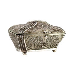 Filigree silver box with reliefs and monogram plaque on the lid