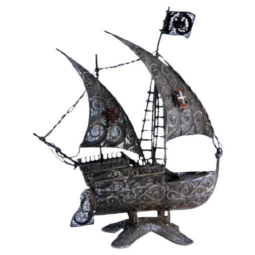 Filigree silver caravel with enameled crosses on scalloped base