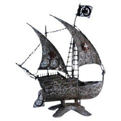 Filigree silver caravel with enameled crosses on scalloped base