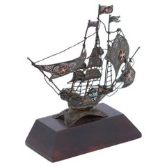 Filigree silver caravel with wooden base