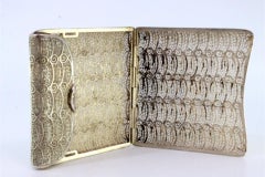 Filigree silver cigarette case with spring and hinged lid