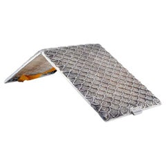 Filigree silver cigarette case with wavy reliefs and hinged lid