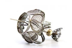 Filigree silver crown alluding to the Holy Spirit