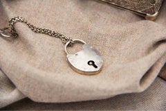 Filigree silver jewelry box with padlock and security key