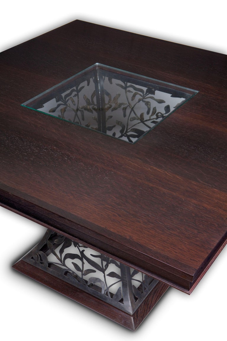 One floor sample in stock now. Holiday sale  25% off. 

Filigree steel and wenge wood dining table 

Shown item is constructed of hand formed steel with a floral filigree pattern and a Wenge wood top with glass Insert. Available now.

New