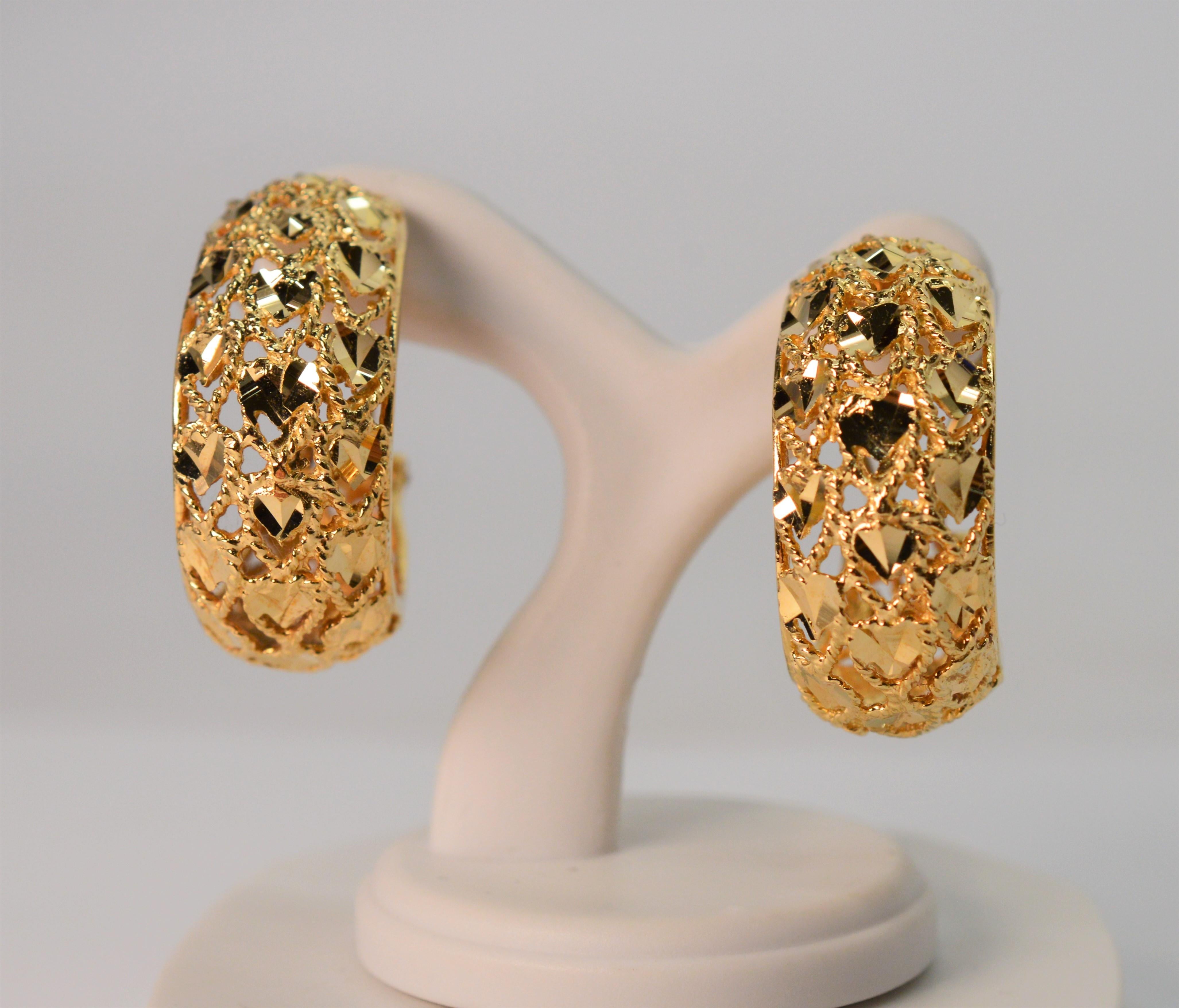 Add a splash of dazzling bright color with these attractive fourteen karat 14K yellow gold hoop earrings. At the perfect modest length with an approximate 1 inch drop from the post, the abstract patterned filigree in yellow gold shows plenty of
