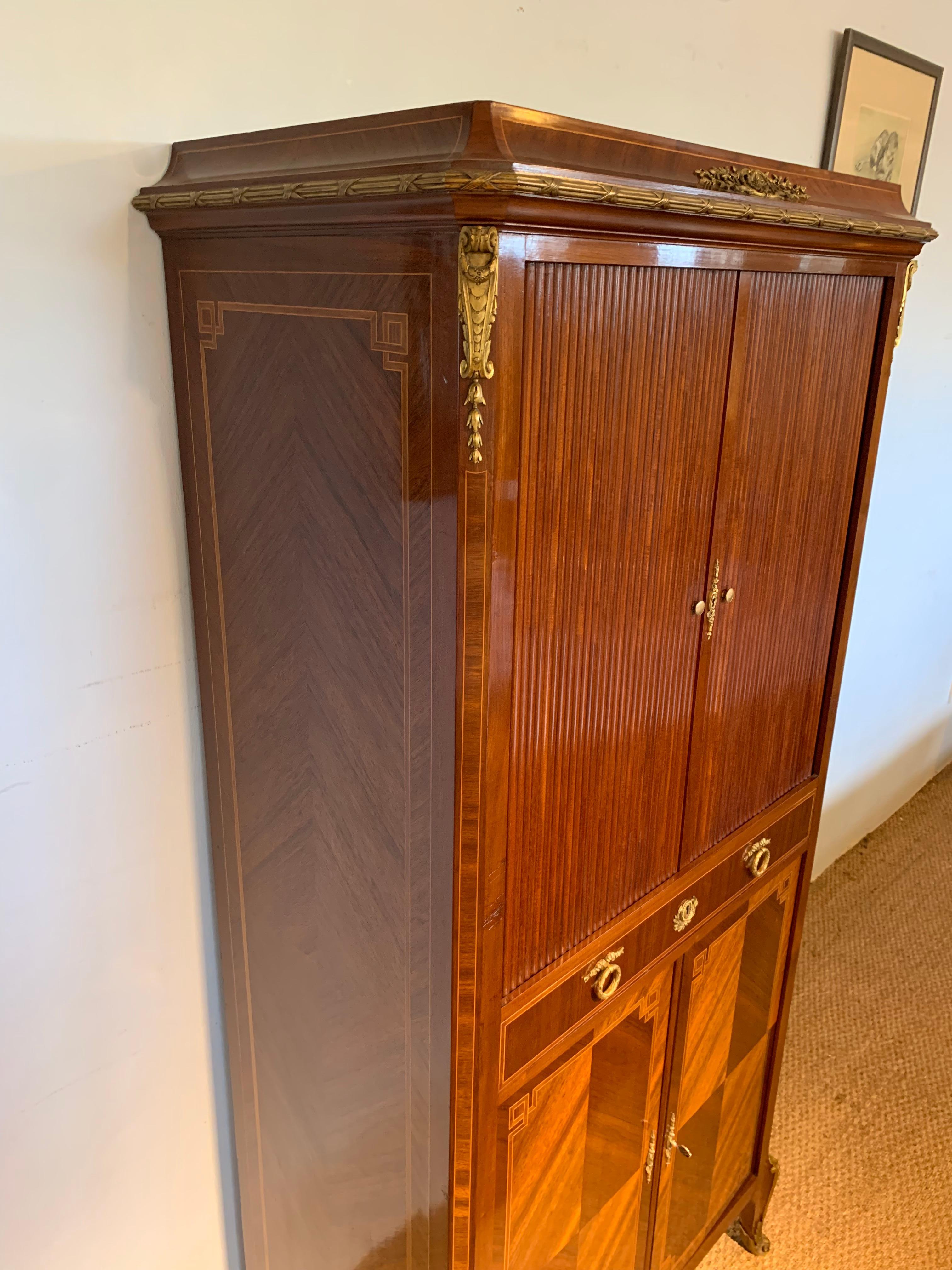 Wonderful quality late 19th century mahogany and ormolu mounted filing cabinet / side cabinet 

Dating to around the 1880s Paris makers label, 2 tambour doors open to reveal 14 compartments, single wide drawer, pair of doors opening to reveal