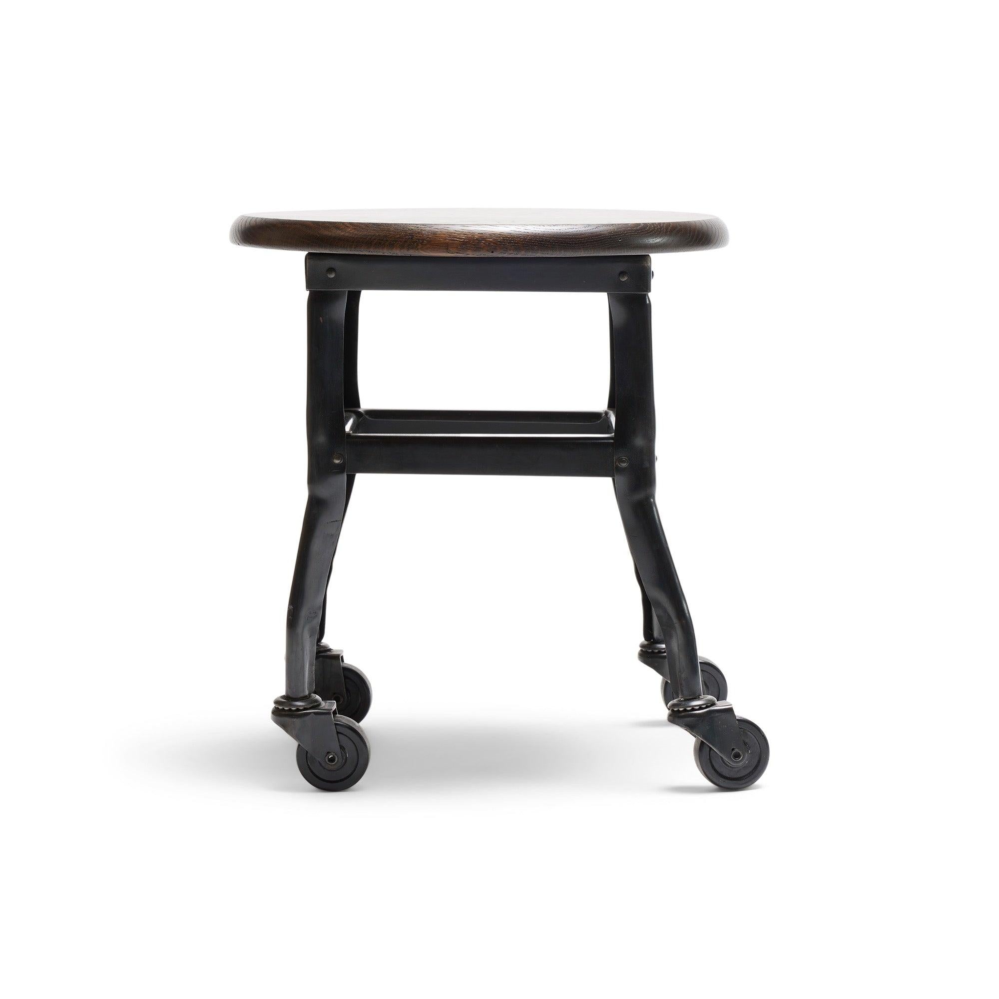 A Toledo stool on casters with a oak wooden top.