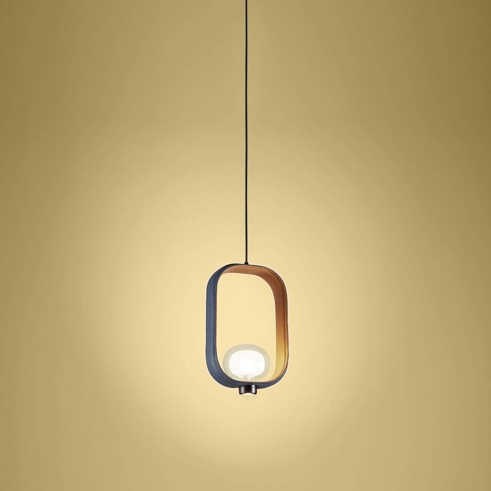Inspired by the classic Chinese lanterns, the inside structure is made by powder coated painted metal, while the outside is tailored with two-tone leather. The light source is located inside a double-side borosilicate glass diffuser, while the